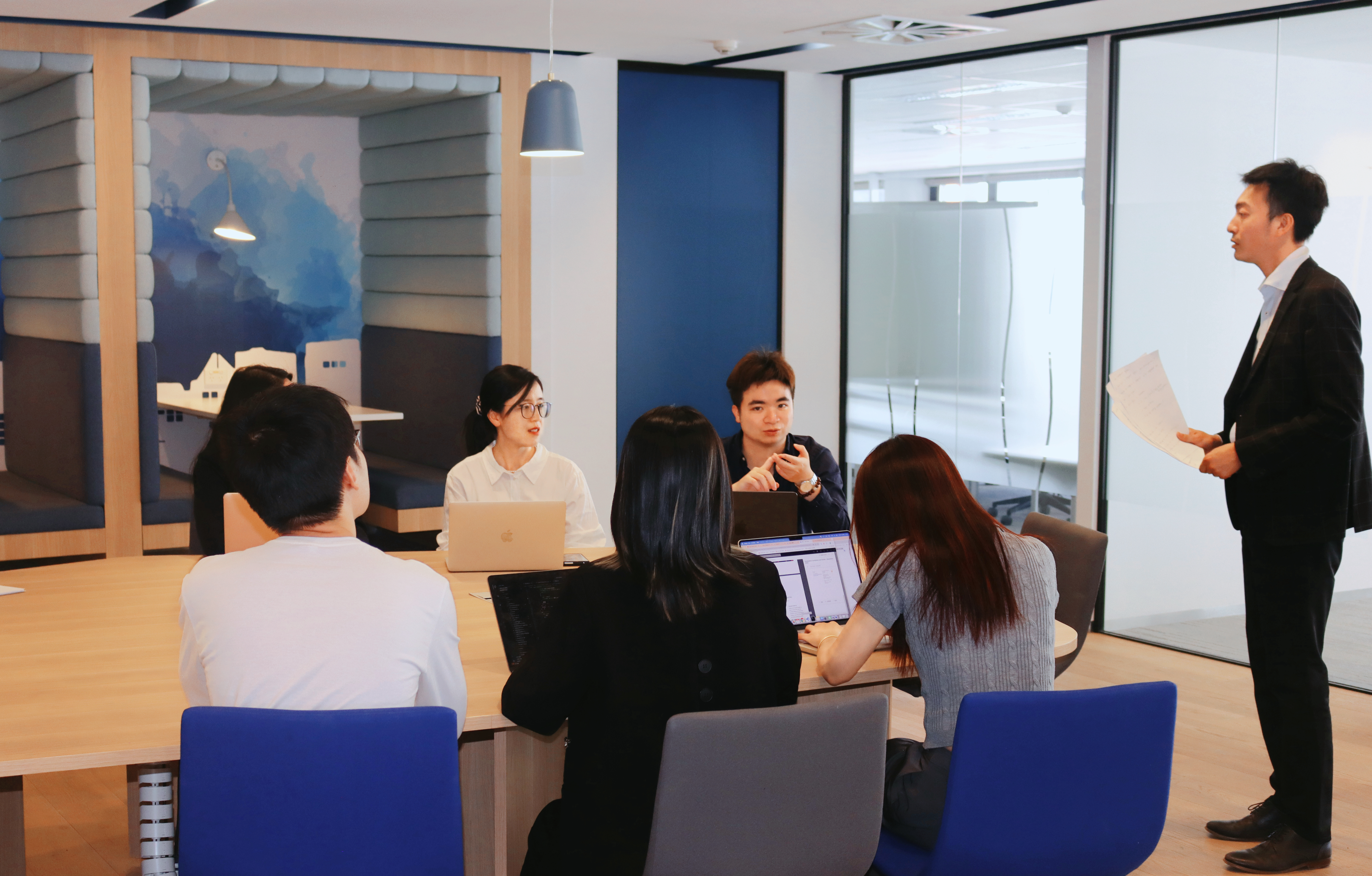 QX Tech staffs during a meeting